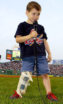 Four-year-old Jordan Leandre sings the National Anthem before the start of a Red Sox game in 2004. 
