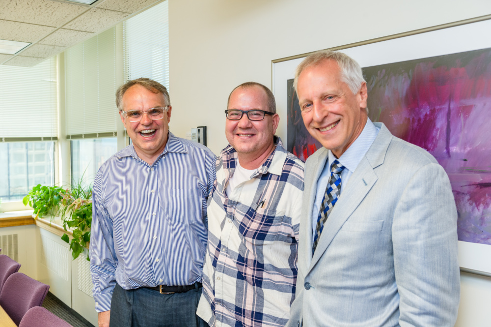 Patient Todd Ellison (middle) returned to Dana-Farber in September 2017 to celebrate the 20th anniversary of his bone marrow transplant.