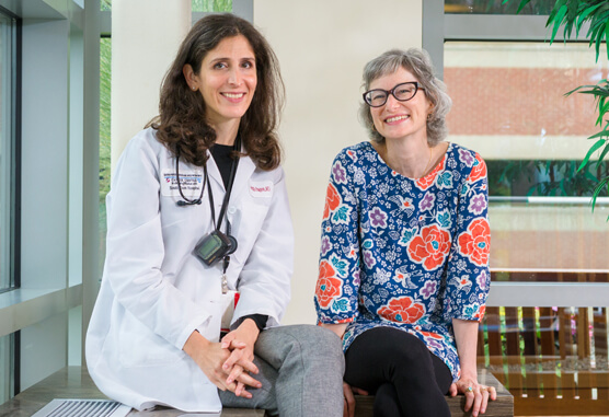 Meredith Faggen, MD, delivers care to Joyce White, a young woman with breast cancer.