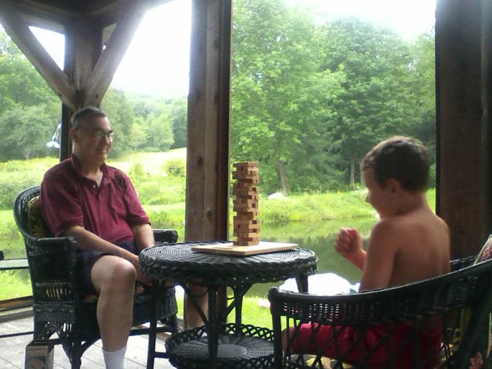 Oliver and Pop Pop on the porch on a summer's day