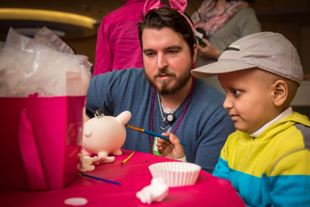 Painting piggy banks is one of the festive activities patients enjoyed on Pig Day.