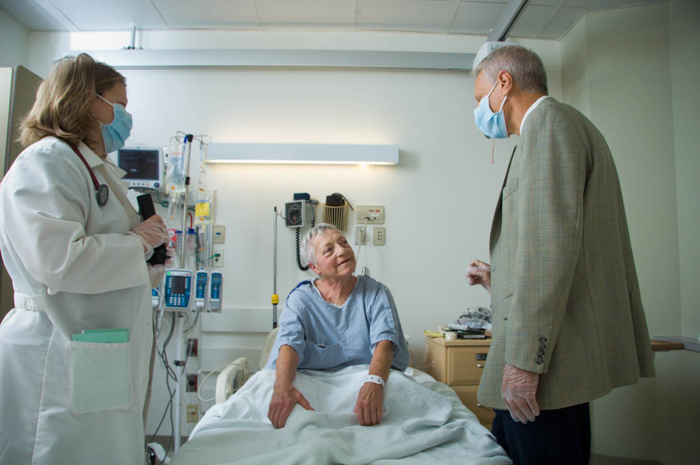 Joseph Antin, MD, explains a procedure to a patient.