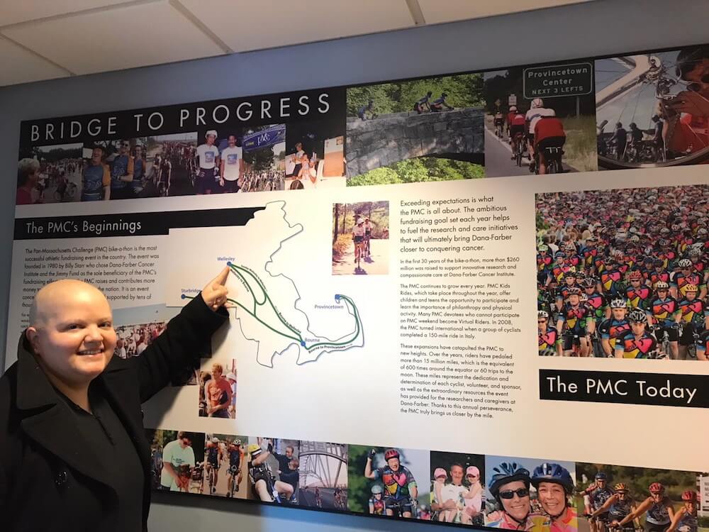 Wisnia and the poster exhibits that inspired her to do the Pan-Mass Challenge (PMC).