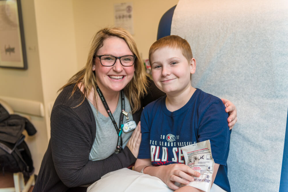 Cole Malone and child life specialist Amanda Dean, MS, CCLS.