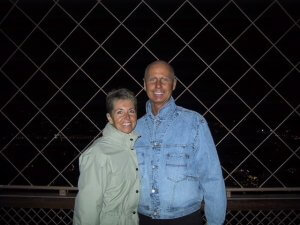 John Ferris — here with wife Valerie at the Eiffel Tower in fall 2016, shortly before his cancer diagnosis — plans to resume traveling in Europe around his ongoing treatment.