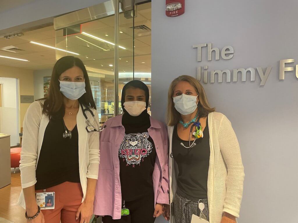 Sara Almheiri (center) at a May 2022 check-up at the Jimmy Fund Clinic with her oncologist Alison O’Neill (left) and nurse practitioner Casey Wall (right).