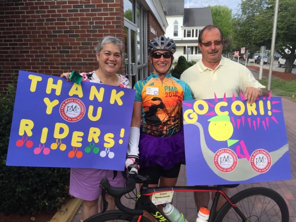 Barbie's patient Sue Cocco (right) and her boyfriend, Bill Gould, also cheer on Bill's daughter, Cori Newcomb (center), a fellow cancer survivor and longtime PMC rider. 