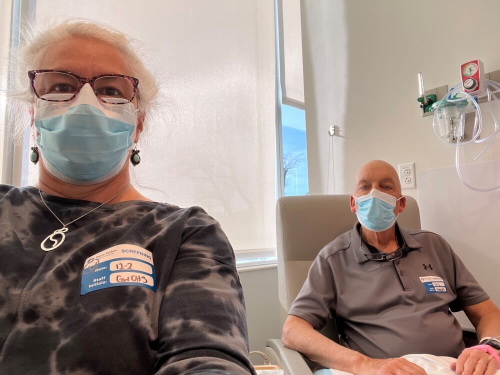 Accompanied by his wife Ann (foreground), Doug Kroc starts his newest chemotherapy protocol at Dana-Farber Brigham in December 2022. 