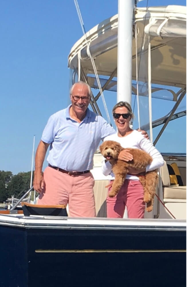 Candy Langford, husband Larry, and their dog, Gracie, enjoy a trip on their boat.