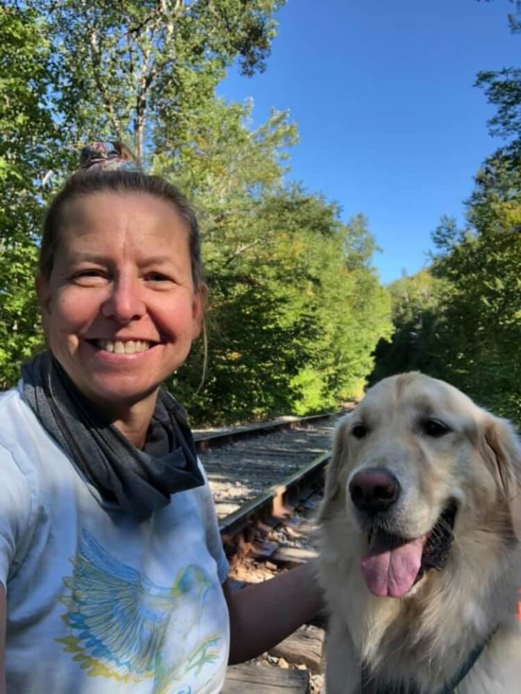 Laura Orfanedes hiking with her dog, Ziggy.