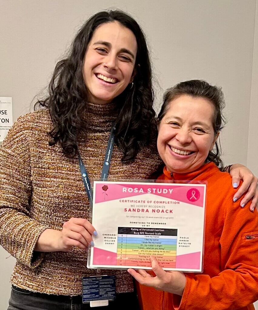 Sandra (right) with her trainer, Paola and her ROSA study completion certificate. 