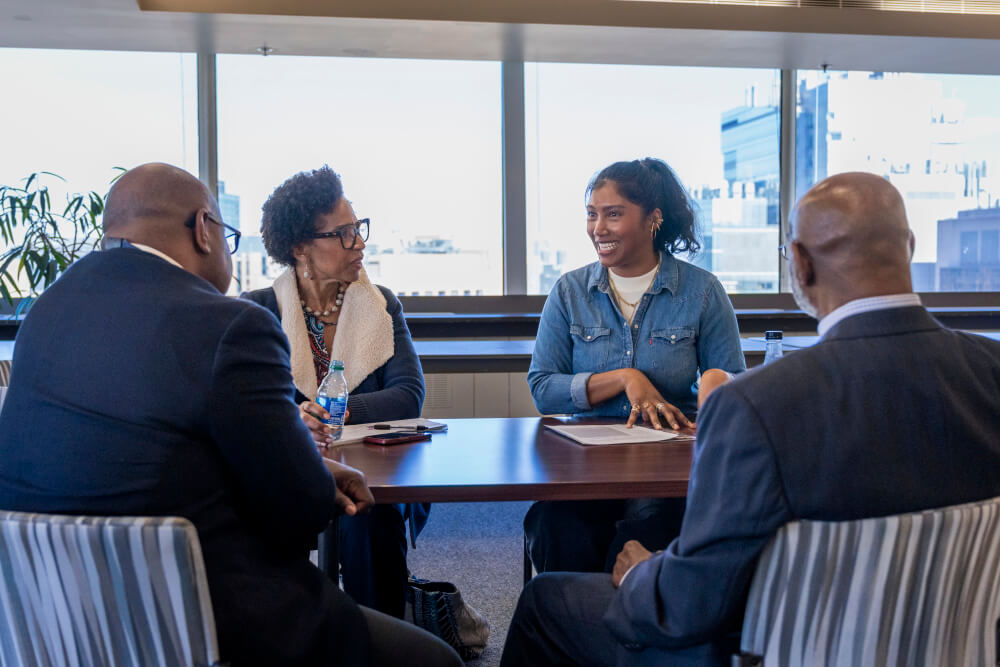 Simone Ledward-Boseman (in denim shirt) discusses the importance of early detection for colon cancer with leaders from Dana-Farber's Gastrointestinal Cancer Center and Care Care Equity Program.