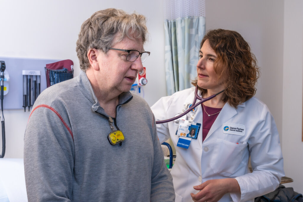 Elizabeth Buchbinder, MD, with patient Christopher Cobb discussing TIL Therapy. 