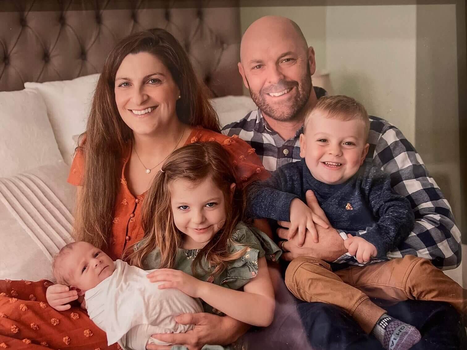 Jay Reese (rear right) and his wife Lauren with their daughter Hailey (6), son Caleb (3), and new baby Charlie in late 2022.