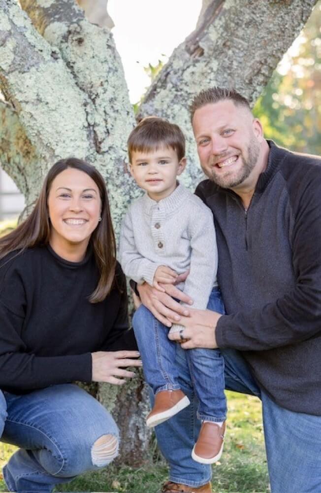 In between her chemotherapy and radiation treatment, Andrea posed for an Oct. 2023 family portrait with her husband, Jeff, and son, JJ.