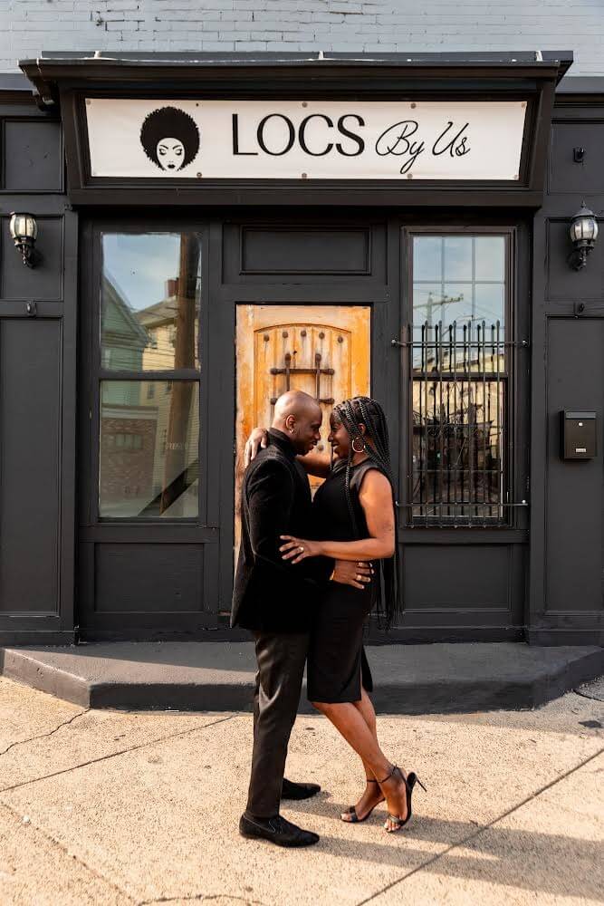 Shirley and Mike Joseph in front of Locs by Us. Courtesy of Smitten With Bliss Photography.