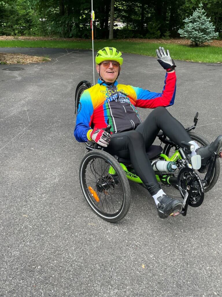 Combes on the recumbent bike he rides today. 