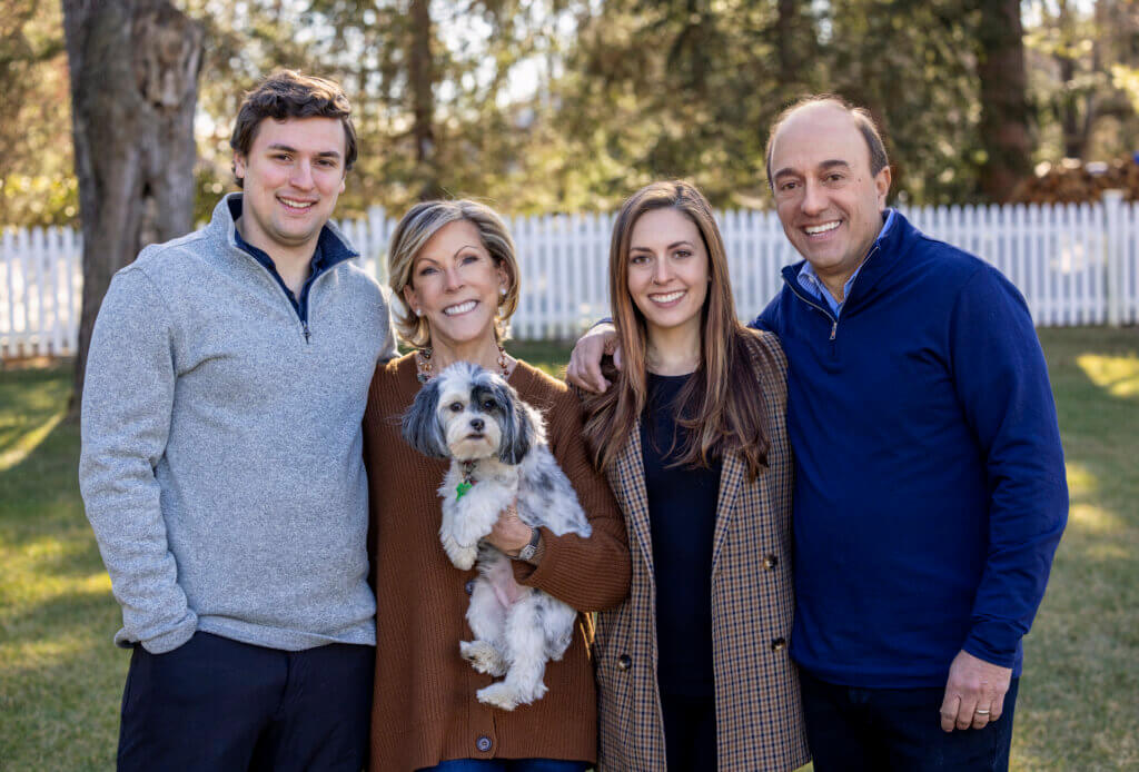 Kathy Giusti(holding Scout) with (left to right) her son, David, daughter, Nicole, and husband, Paul. 